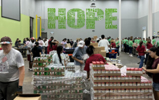 Volunteers pack disaster boxes for Hurricane Beryl relief