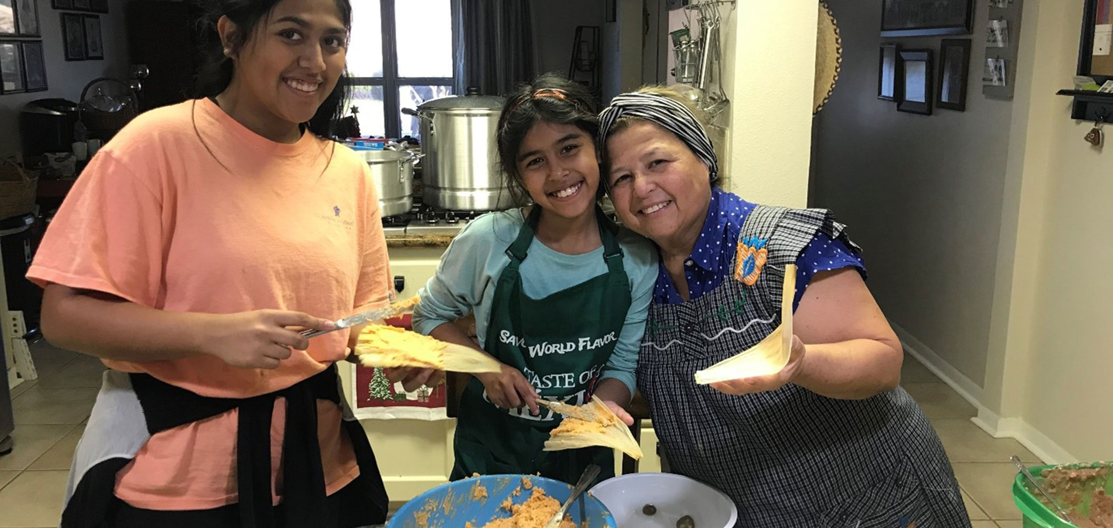 Tamales: A Taste of Tradition and Culture. In the photo from left to right (Sofia (sister), Lily (sister), Sulema (Grandmother)