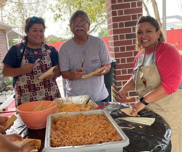 Making Tamales In this photo from left to right (Christina (Tia), Manuel (Grandfather), Cyndi (Mother)