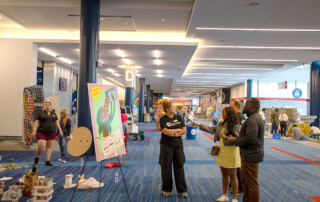 Teams work to finish their builds at Canstruction 2024